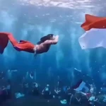 Viral Aksi Unik Gubernur Sherly Kibarkan Bendera Merah Putih di Dasar Laut Maluku Utara