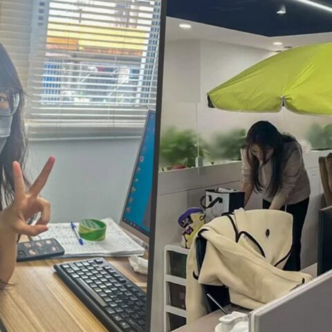 Tren Pekerja China Pakai Payung di Meja Kantor Lawan Paparan Cahaya dan Udara Kering